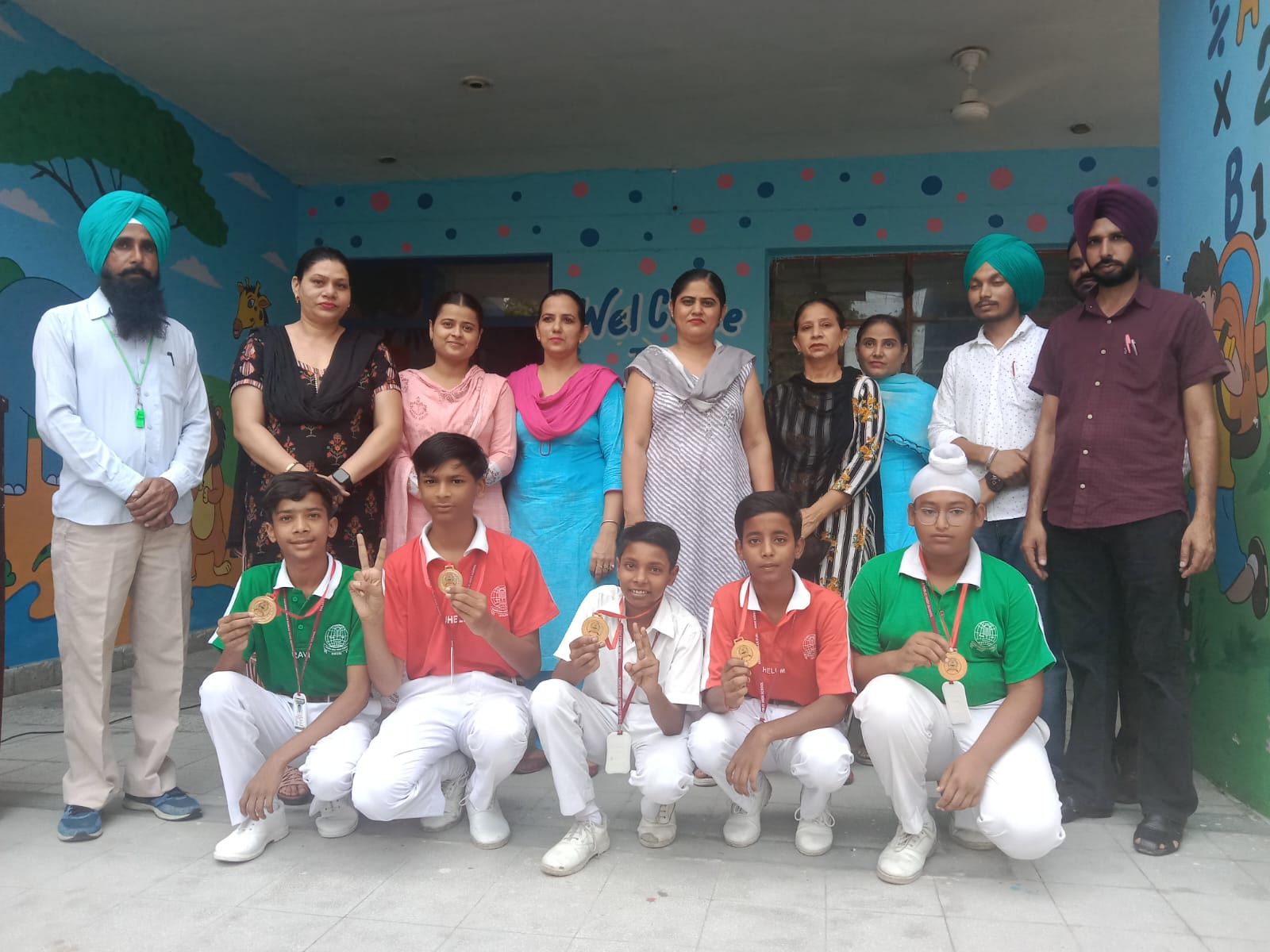 Medal winners with teachers